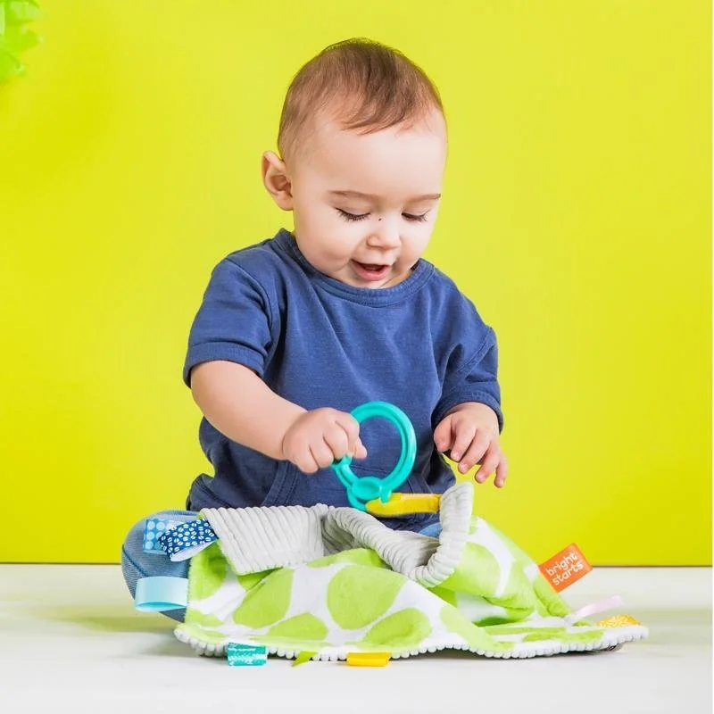 Maznacia dečka na C krúžku Little Taggies zelené bodky 0m+