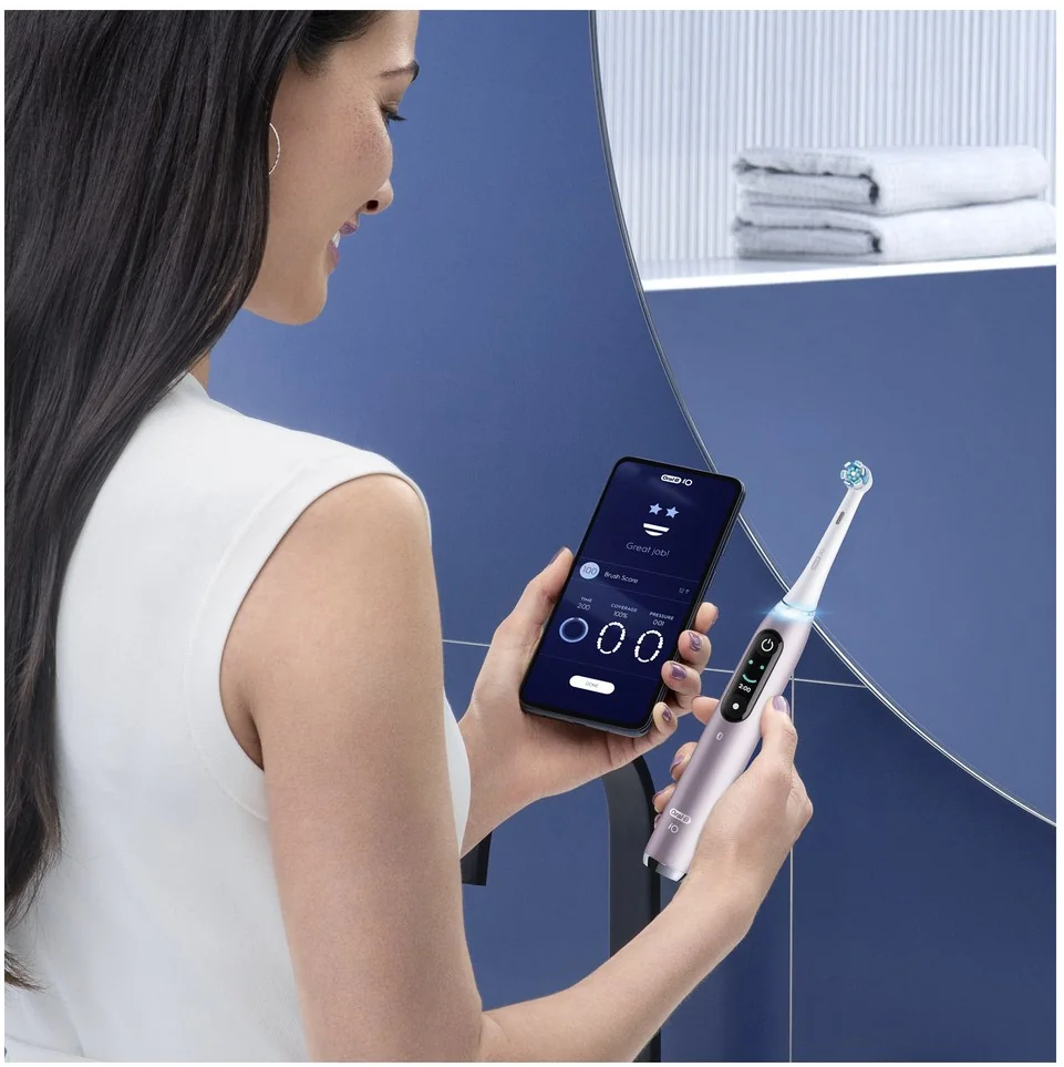 Oral B EK iO Series 9 Rose Quartz + držiak zubnej kefky + cestovné púzdro 1×1 set, elektroniícká zubná kefka